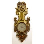 18/19th Century French Carved Gilt Wood Barometer. Hand painted Dial and Gauge. Typical Wear, Cracks