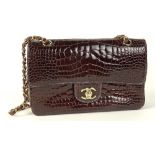 From a Palm Beach Socialite, A Chanel Brown Alligator/Crocodile Double Flap Bag. Goldtone