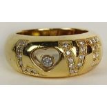 Lady's Chopard 18 Karat Yellow Gold and approx. .29 Carat Diamond Love Happy Diamonds Ring. Signed