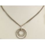 Movado Round Cut Diamond and 18 Karat White Gold Pendant Necklace. Diamonds E-F Color, VS Clarity.