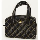 From a Palm Beach Socialite, A Chanel Surpique Wild Stitch Tote Bag. Goldtone CC Logo On Front,