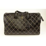 From a Palm Beach Socialite, A Large Chanel Surpique Wild Stitch Tote Bag. Goldtone CC Logo On