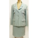 From a Palm Beach Socialite, A Retro Chanel Light Teal 2 Piece Boucle Suit. The Jacket and Skirt,