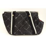 From a Palm Beach Socialite, A Chanel Nylon Small Dog Carrier. Silver tone Logo Hardware. Wear