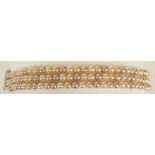 Lady's Triple Strand Champagne Pearl Bracelet with 14 Karat White Gold Clasp. Signed. Pearls Measure