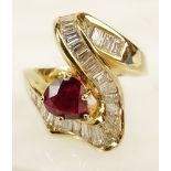 Lady's vintage pear shape ruby, baguette cut diamond and 18 karat yellow gold ring. Ruby with