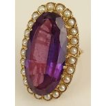 Lady's vintage large oval cut amethyst, seed pearl and 14 karat yellow gold ring. Amethyst