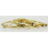 Three vintage 14 karat yellow gold bangle bracelets, one with small round cut diamonds and