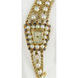 Lady's Edwardian 14 Karat Yellow Gold, diamond, sapphire and pearl bracelet watch. Signed 14K. Not