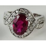 Lady's approx. 2.0 carat oval cut red tourmaline, .55 carat diamond and 14 karat white gold ring.