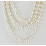 Lady's vintage three strand pearl necklace with 18 karat white gold clasp accented with pearls and