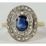 Lady's vintage French oval cut sapphire, diamond and 18 karat yellow gold ring. Sapphire measures