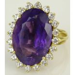 Lady's Amethyst Diamond 14 Karat Yellow Gold Ring-Dant. The large faceted center stone, 15mm x