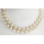 Vintage 7mm Pearl Necklace. Hand knotted. 9mm Pearl Clasp signed 14K. Good condition. Measures 12-