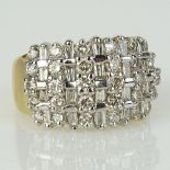 Lady's Approx. 2.0 Carat Round and Baguette Cut Diamond and 14 Karat yellow Gold Ring. Diamonds H-