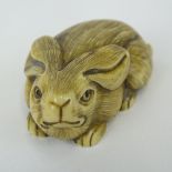 Early 20th Century Japanese Baisho Shop Carved Netsuke In The Form of a Hare. Finely Incised. Signed