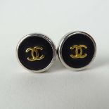 Pair of Lady's Chanel Button style Earrings with Logo. Signed. Good condition with box. Measure 3/