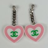 Pair of Lady's Chanel Heart/Logo Earrings. Good condition with box. Measure 1-3/8 inches long and