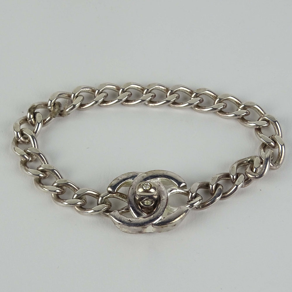 Lady's Chanel Bracelet with Logo and faux Diamond Clasp. Signed. Good condition with box. Measures