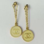 Pair of Lady's Chanel Earrings with Logo. Signed. Good condition with box. Measure 3/4 inch