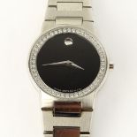 Lady's Vintage Movado Swiss Quartz Movement Watch with Diamond Bezel. Surface scratches to stainless