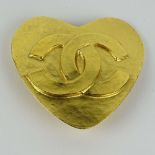 Chanel, Made in France Gold Tone Metal Heart Brooch with Logo. Signed. Good condition with box.