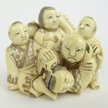 Early 20th Century Japanese Carved Netsuke of 5 Figures in a Pile. Signed with artists signature