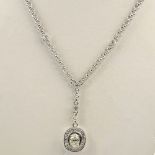 Lady's Diamond and 18 Karat White Gold Pendant Necklace with Center 1.0 Carat Oval Cut Diamond, J
