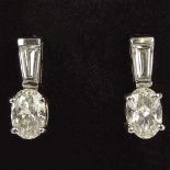 Lady's Approx. 1.43 Carat Oval and .47 Carat Tapered Baguette Cut Diamond and 14 Karat White Gold