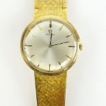 Men's Vintage Omega 14 Karat Yellow Gold Manual Movement Watch with Flexible Link Bracelet. Signed