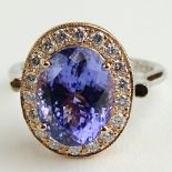 Lady's BHGL Appraised 5.0 Carat Oval Cut Tanzanite, .40 Carat Round Cut Diamond and 14 Karat Gold