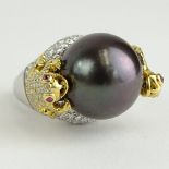 Lady's 16.5mm Black Tahitian Pearl, Round Cut Diamond and 18 Karat Gold Ring. Diamonds E-F-G