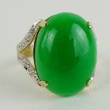 Vintage Jadeite and 14 Karat Yellow Gold Ring accented with Pave Set Round Cut Diamonds. Signed 585.