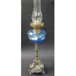 A large oil burner lamp with a decorativ