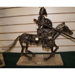 Metal sculpture of a knight on horseback