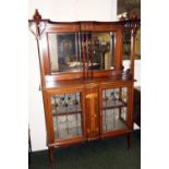 Mahogany Art Nouveau cabinet with naturalistic floral design - two leaded glazed doors with coloured