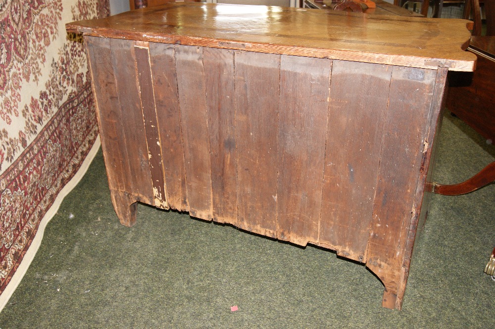 An 18th century Flemish oak and mahogany commode chest of three serpentine-fronted drawers, - Image 9 of 10