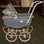 Tri-ang by Lines Brothers, London, a coach-built dolls pram with sprung chassis in original