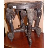 Heavily carved and inlaid oak elephant table