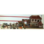 A selection of vintage farmyard animals and machinery, some by Britains and Dinky Supertoys, a