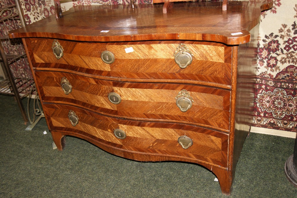 An 18th century Flemish oak and mahogany commode chest of three serpentine-fronted drawers, - Image 2 of 10