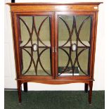 A Sheraton revival mahogany two door display cabinet, inlaid with satinwood, each door having an