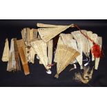 A selection of hand fans, including carved bone and painted silk hand fans, reticulated bone