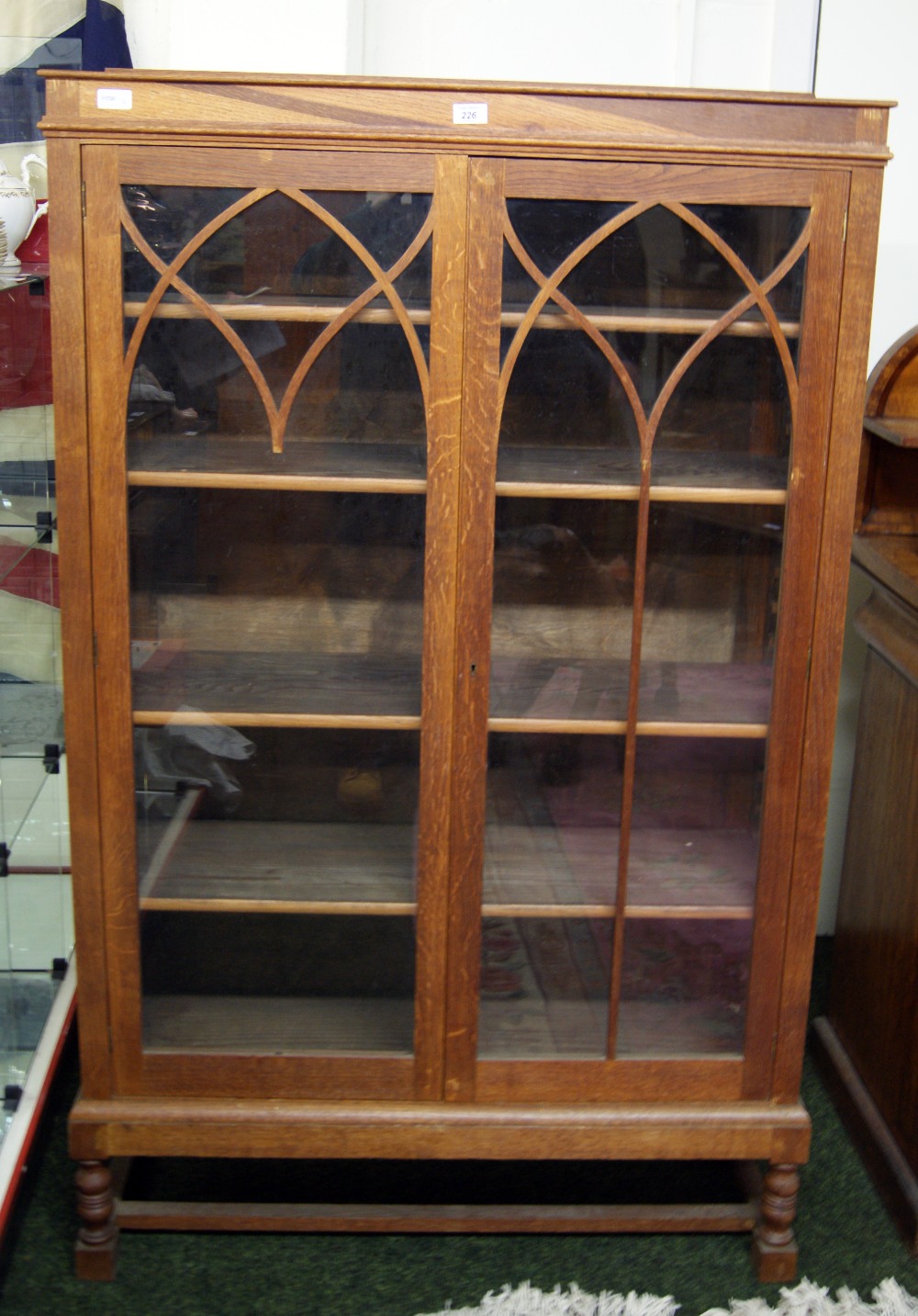 An Art Deco walnut two-door glazed display cabinet