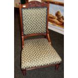 Antique carved upholstered low-seated chair