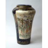 A late 19th century Japanese ceramic vase, with painted panels and gilt highlights against a cobalt