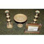 Metalware to include a pair of early brass candlesticks, desk calendar and a tazza