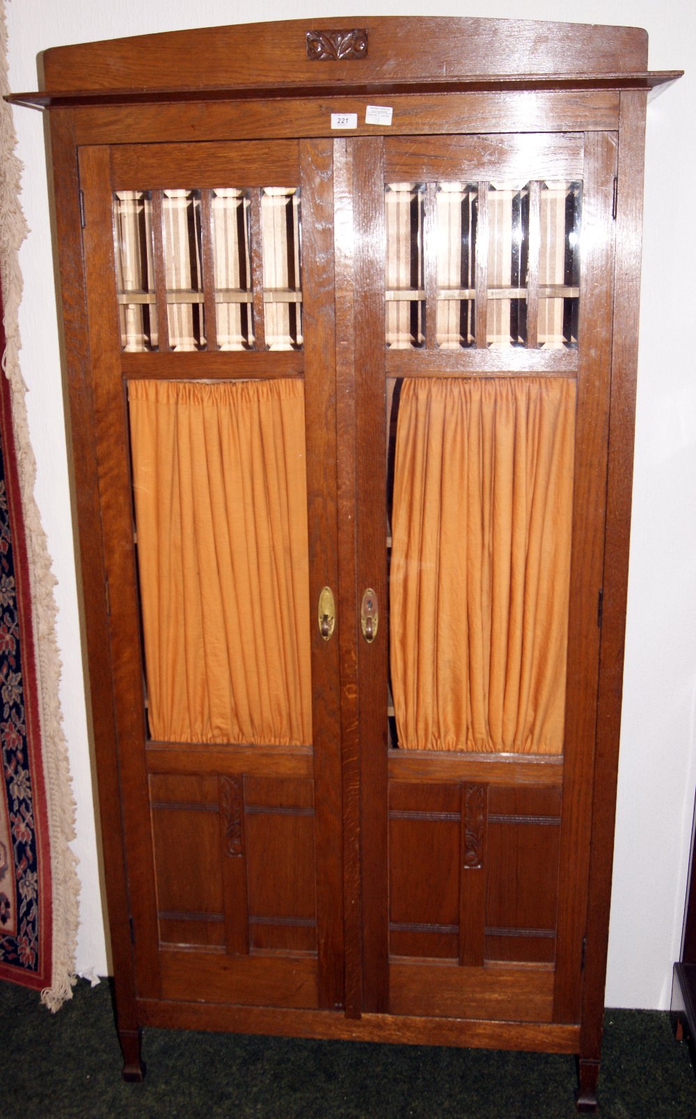 Two-door glazed oak shelved unit