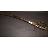 An antique sabre, brass hilt and decorative blade. Marks indistinct  CONDITION REPORT; Grip in