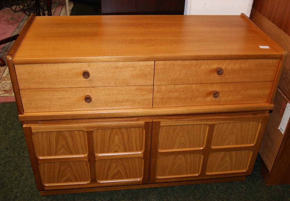 A Nathan glazed wall unit and a Nathan two-door/four-drawer unit